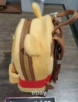 Loungefly Winnie the Pooh Bear Honey Tummy Mini Backpack New. In hand