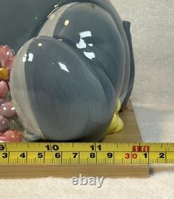 Disney -Vintage- Figurine de boîte à biscuits Eeyore avec fleurs - Années 1990 en bon état Disney -Vintage- Figurine de boîte à biscuits Eeyore avec fleurs - Années 1990 en bon état