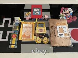 Ensemble Winnie l'Ourson (montre de jeu Disney Store, Bemani DDR Pocket, sac à dos)