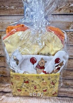 Panier-cadeau pour bébé Winnie l'ourson de 28 pièces. Tous les bénéfices seront donnés.